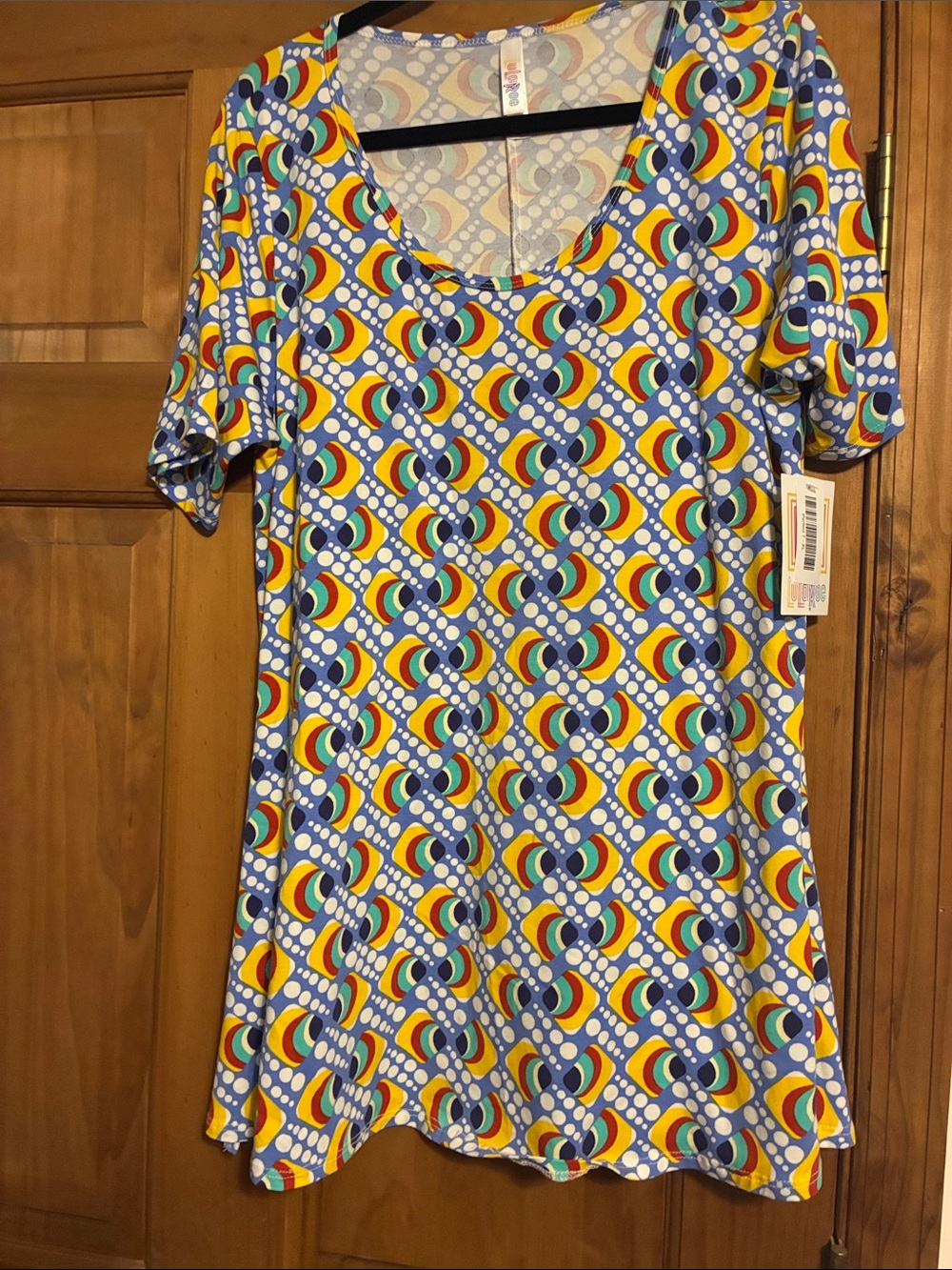 LuLaRoe Blue Multicolor Geometric Print women’s top.
